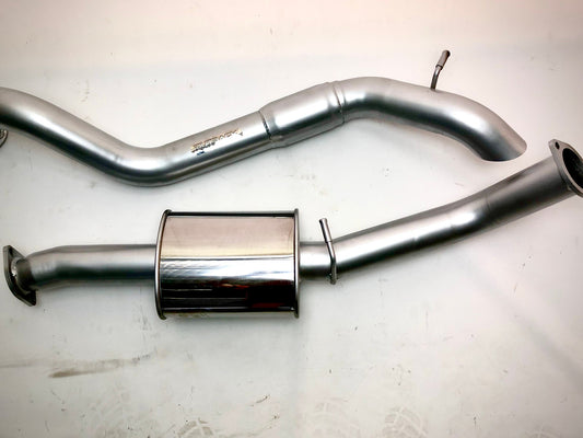 Image of a 3-inch Outback Exhausts  SCR filter back system designed for a Ford Everest 3.2L 
Turbo Diesel Engine. The system features mandrel-bent 409 stainless steel pipes with welded flanges at both ends and mounting brackets. One of the pipes includes a muffler. The system is displayed against a transoarent background .  SKU OE6612-S.